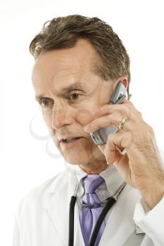 Royalty Free Photo of a Doctor Talking on a Cellphone