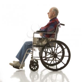 Profile view of Caucasion elderly man sitting in wheelchair.