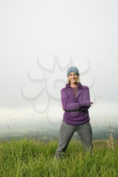 Royalty Free Photo of a Woman Standing in a Field