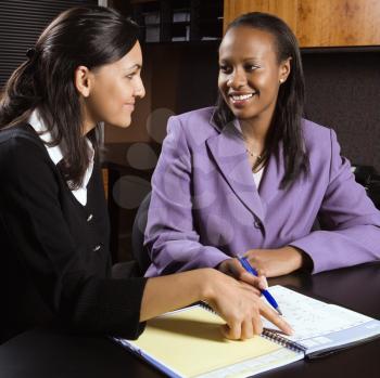 Royalty Free Photo of Businesswomen Working Together in an Office