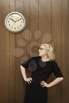 Royalty Free Photo of a Woman Watching a Clock