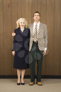 Royalty Free Photo of a Man in a Retro Suit With His Arm Around a Woman