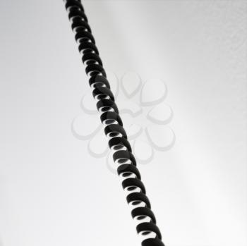 Royalty Free Photo of a Curly Black Telephone Cord