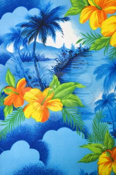 Close-up of bright blue Hawaiian vintage fabric with orange hibiscus flowers printed on polyester.