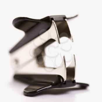 Royalty Free Photo of a Staple Remover on a White Background With Selective Focus