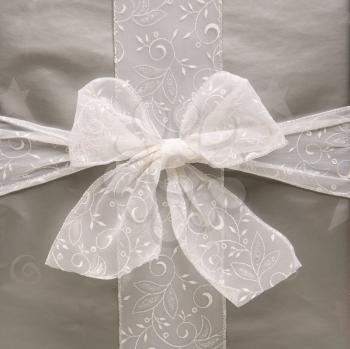 Royalty Free Photo of a Large Silver Wrapped Christmas Gift With a Bow