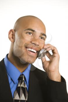 Royalty Free Photo of a Businessman in a Suit Talking on a Cellphone