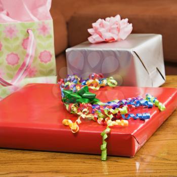 Royalty Free Photo of Presents Wrapped and Decorated with Bows on a Table