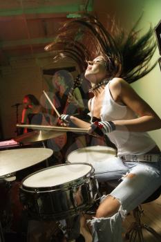 Royalty Free Photo of a Girl Band Playing Instruments