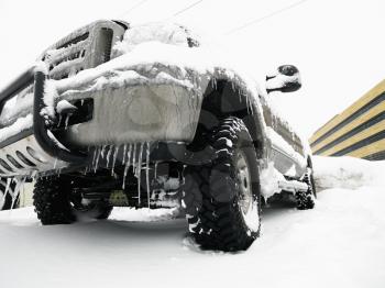 Royalty Free Photo of a SUV Covered in Snow and Ice