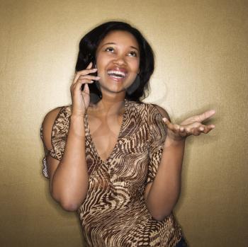 Royalty Free Photo of a Woman Talking on a Cellphone Smiling