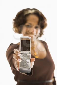 Royalty Free Photo of a Woman Holding Out a Cellphone