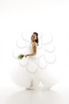 Royalty Free Photo of a Bride Holding a Bouquet 