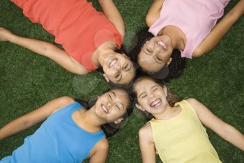 Royalty Free Photo of Four Girls Lying Laughing