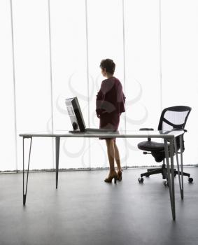Royalty Free Photo of a Businesswoman Standing in an Office