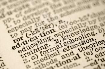 Selective focus of dictionary entry for the word education.