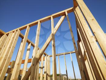 Royalty Free Photo of a Low Angle View of New Construction Framework For a House 