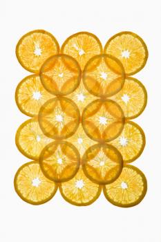 Royalty Free Photo of Orange Slices Arranged in a Square Design on a White Background