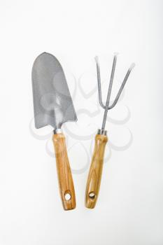 Royalty Free Photo of Hand Held Spade and Gardening Fork
