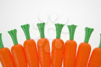 Royalty Free Photo of a Bunch of Carrots Lined Up on a White Background