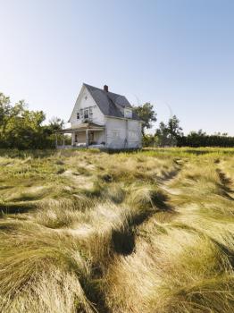 Royalty Free Photo of an Abandoned House in a Field