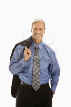 Royalty Free Photo of a Middle-aged Businessman Smiling With Jacket Draped Over Shoulder