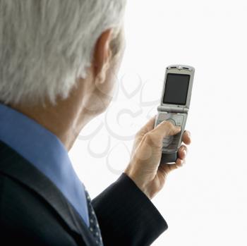 Royalty Free Photo of a Man Looking at a Cellphone