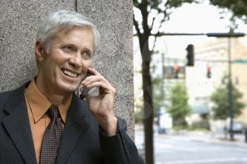 Royalty Free Photo of a Middle-aged Businessman Talking on a Mobile Phone