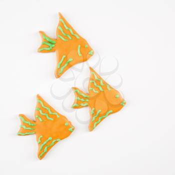 Royalty Free Photo of Three Fish Shaped Sugar Cookies With Decorative Icing