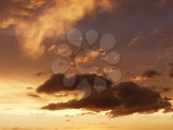 Royalty Free Photo of Clouds in an Orange-Yellow Sky