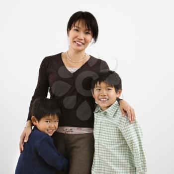 Portrait of Asian mother with two young sons.