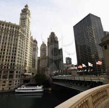 Royalty Free Photo of the Chicago River Scene With Bridge and Boat in Chicago, Illinois