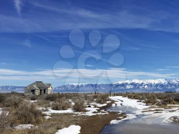 Royalty Free Photo of a Scenic Landscape in Rural Snowy Colorado of an Abandoned House
