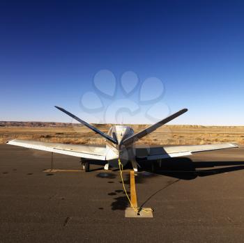 Plane parked on tarmac at Canyonlands Field Airport, Utah, United States.