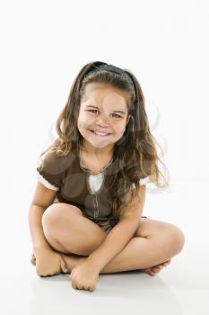 Royalty Free Photo of a Cute Girl Sitting and Smiling