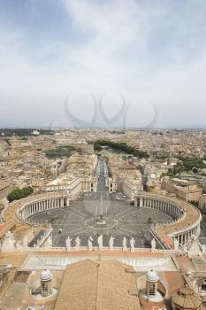 High angle view of St Peter's Square with skyline of Vatican City in the background. Vertical shot.