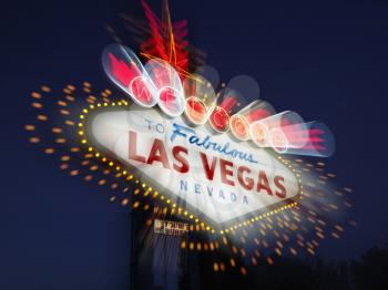 Welcome to Fabulous Las Vegas Nevada sign with motion zoom blur at night. Horizontally framed shot.