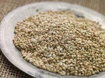 Royalty Free Photo of Grains of Quinoa on a Pewter Plate