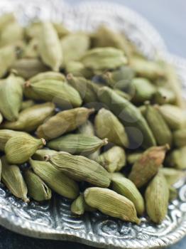 Royalty Free Photo of a Dish of Green Cardamom Pods