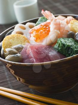 Royalty Free Photo of Sushi Rice Bowl With Tuna Salmon Prawn Tofu and Vegetables