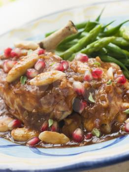 Royalty Free Photo of Breast of Chicken with Pomegranate and Almonds