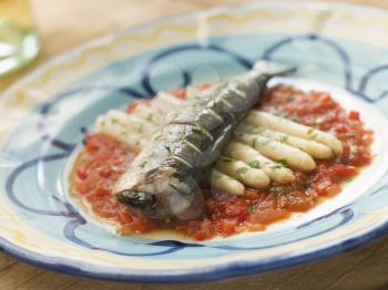 Royalty Free Photo of Grilled Sardines with White Asparagus and Roasted Red Pepper Salsa