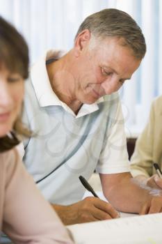 Royalty Free Photo of an Adult Male Taking Notes