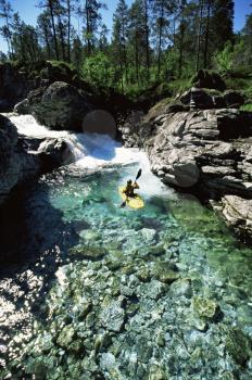 Royalty Free Photo of a Kayaker in Calm Water