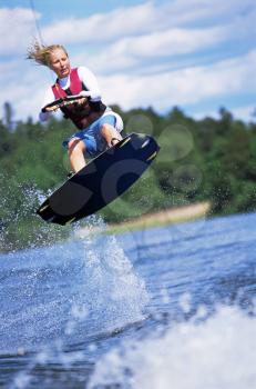 Royalty Free Photo of a Woman on a Water Board