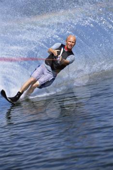 Royalty Free Photo of a Man Water Skiing