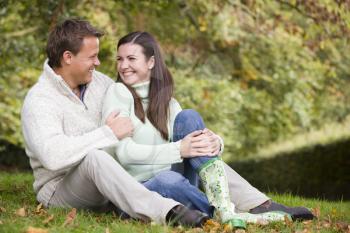 Royalty Free Photo of a Couple Sitting on the Lawn