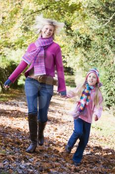 Royalty Free Photo of a Woman and Little Girl on a Country Path