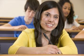 Royalty Free Photo of a Student Taking Notes in Class