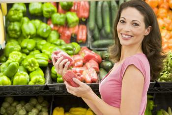 Royalty Free Photo of a Woman Shopping for Peppers